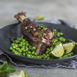 Roasted lamb shanks with peas